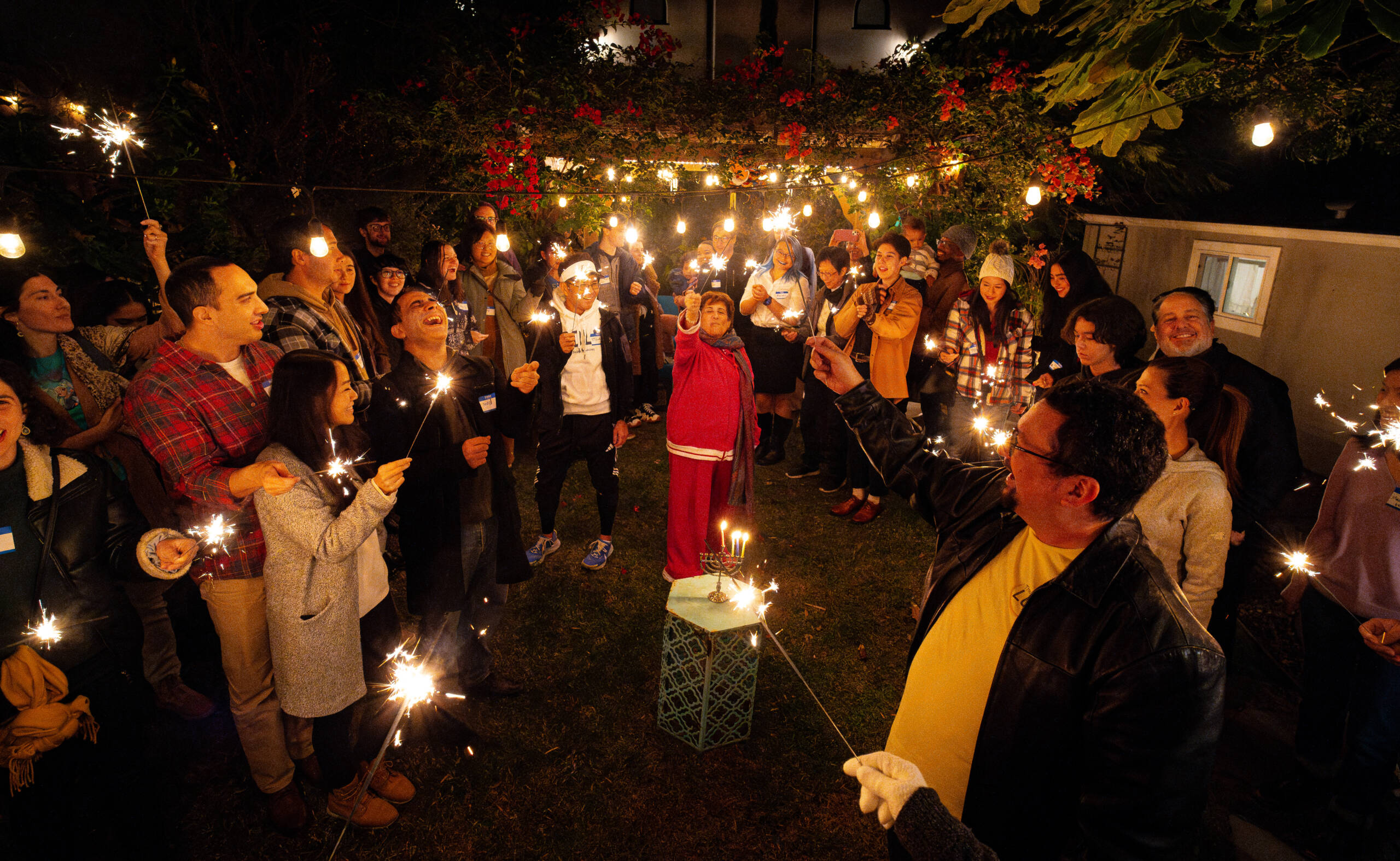 Photo of a group of people holding sparklers