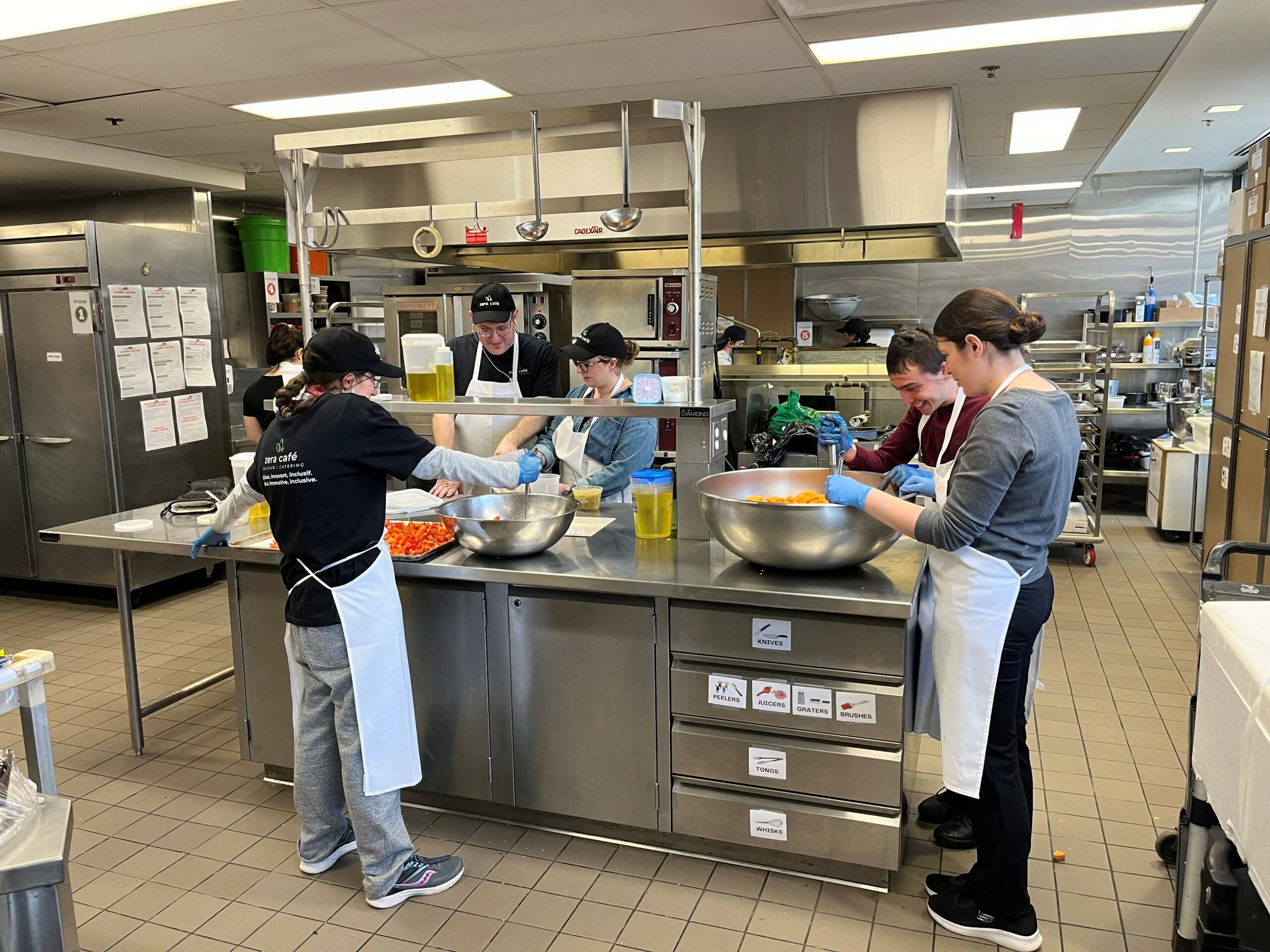 Photo of people working in a kitchen