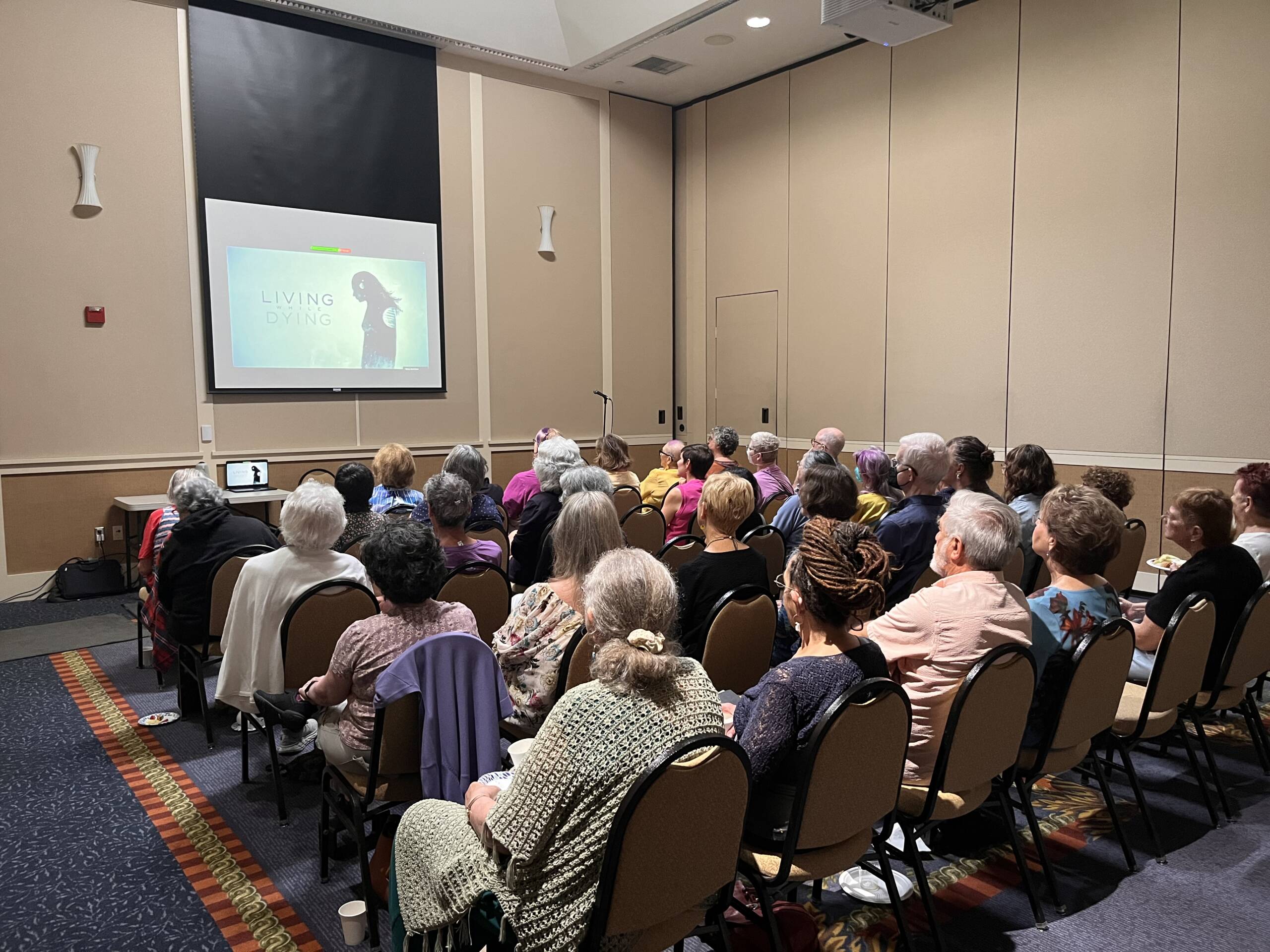 group of people watching a presentation